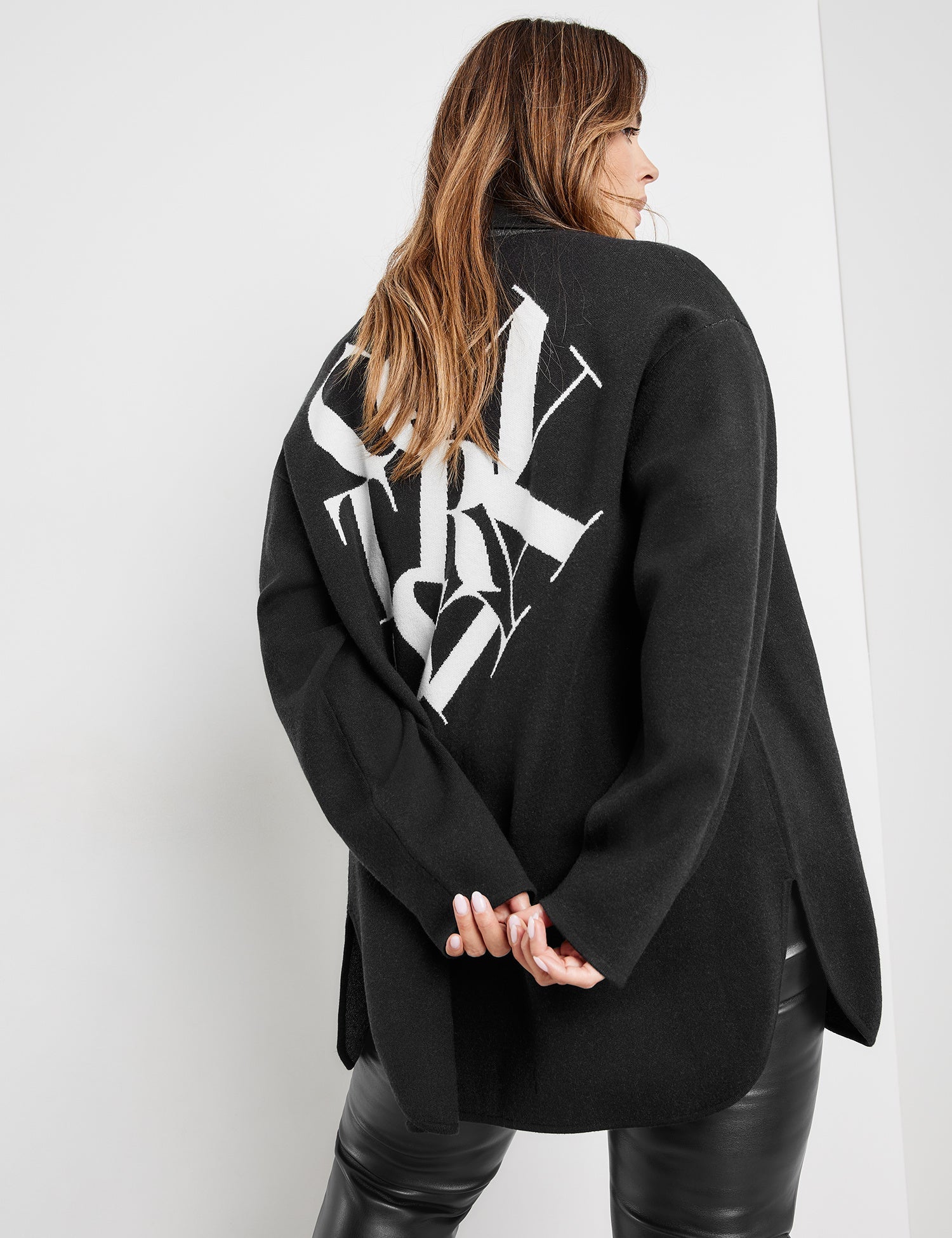 Black Shacket With Text On The Back