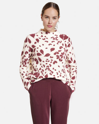 Red Jumper With A Leaf Print